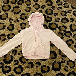 A pink cropped zip up from PacSun